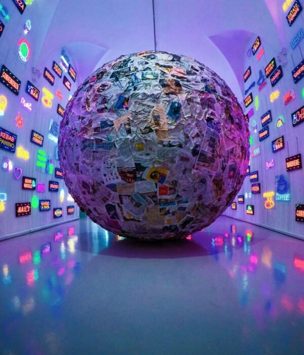 large grey, blue, and brown paper ball ball on display